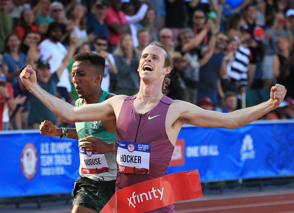 Cole Hocker, right, breaks the tape ahead of Yared Nuguse to win gold in the men’s 1,500 meters during day 4 of the U.S. Olympic Trials at Hayward Field in Eugene Monday, June 24, 2024.