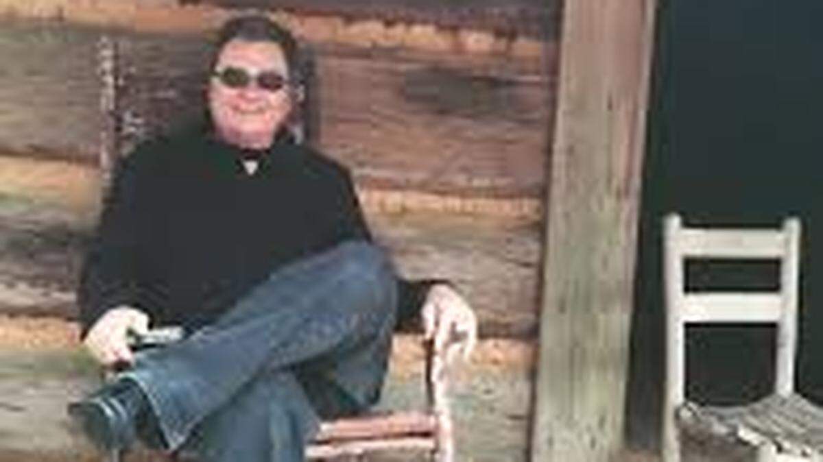 Greg Cote Show podcast host Greg Cote, pictured on vacation after hiking in dress shoes, is given a suerprise birthday party in the new episode.