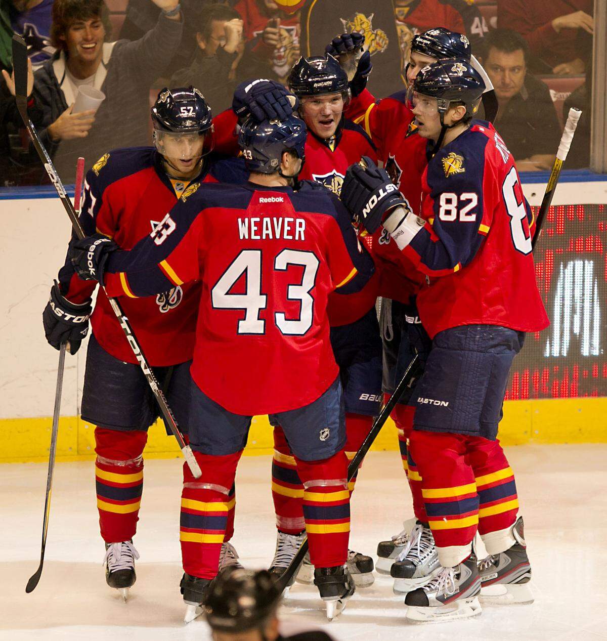 The Florida Panthers celebrate Florida Panthers defenseman Dmitry Kulikov’s (center)goal in the second period in the game between the Florida Panthers and the Vancouver Canucks at Bank Atlantic Center in Sunrise on January 9, 2012.