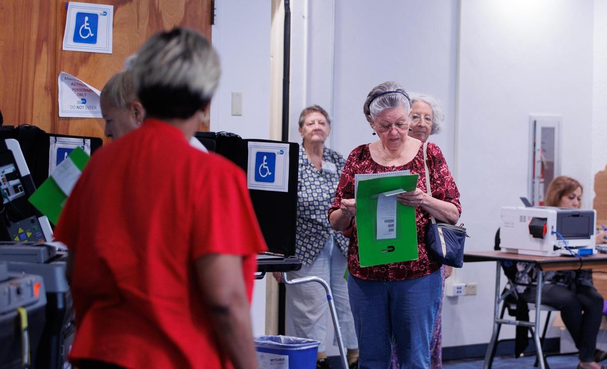 Miami Beach residents get ready to cast their ballots during early voting at Miami Beach City Hall on Tuesday, Oct. 31, 2023.