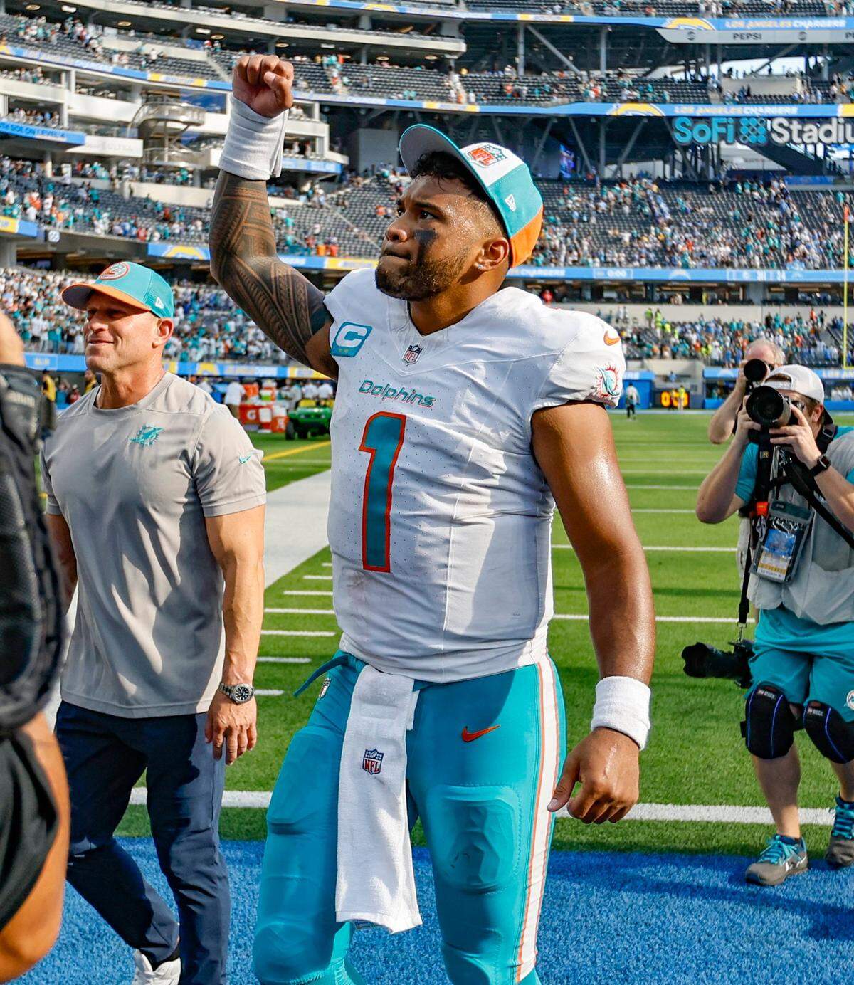Miami Dolphins quarterback Tua Tagovailoa (1) reacts to the crowd after the Dolphins defeat the Los Angeles Chargers at SoFi Stadium in Inglewood, California on Sunday, September 10, 2023.