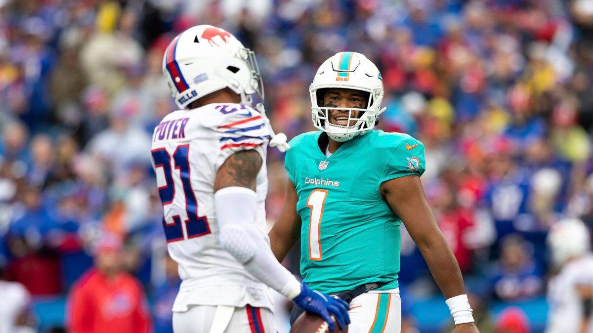 Miami Dolphins quarterback Tua Tagovailoa (1) talks to Buffalo Bills free safety Jordan Poyer (21) after a play during an NFL football game, Sunday, Oct. 31, 2021 in Orchard Park, NY. (AP Photo/Matt Durisko)