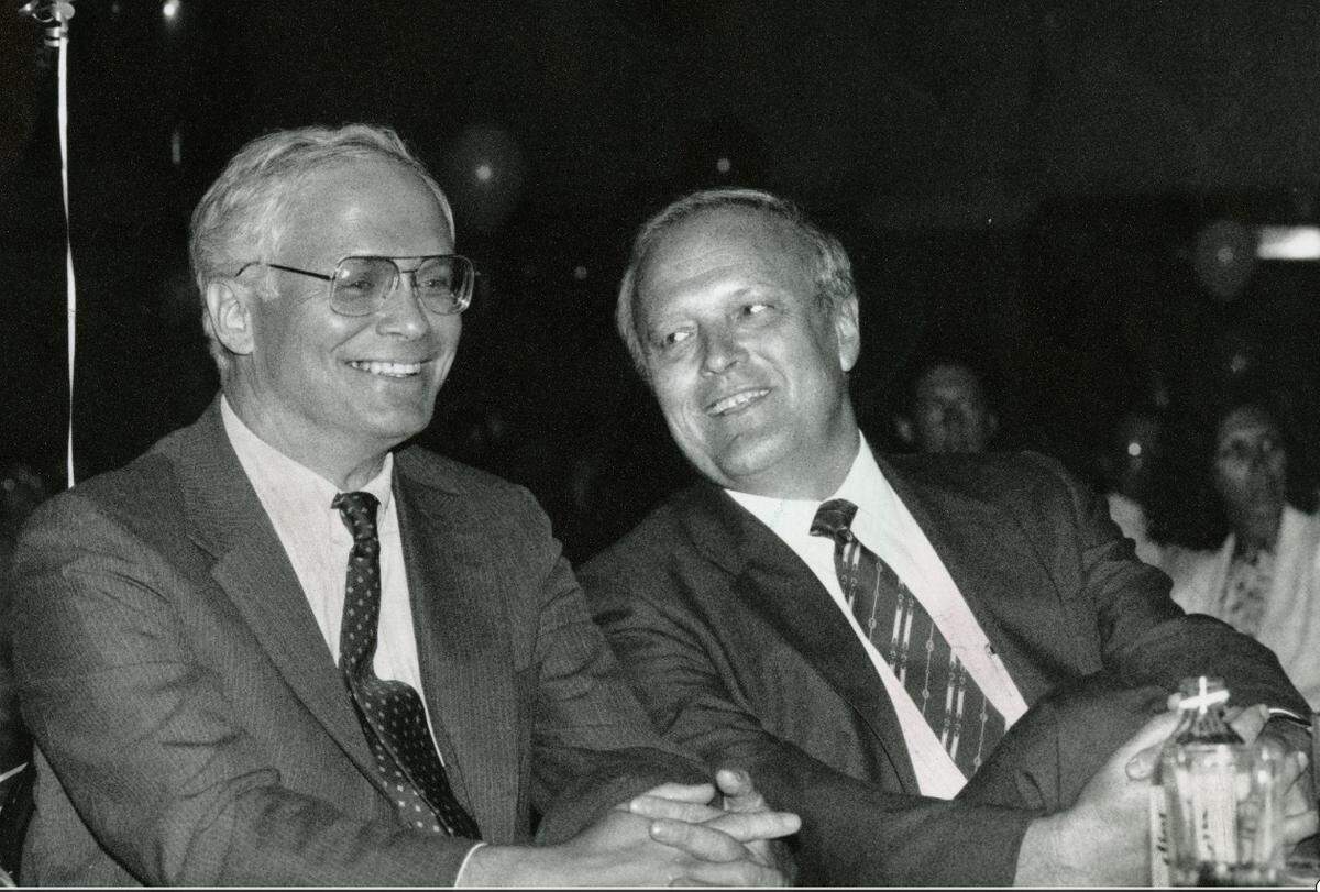 Former Miami Herald publisher David Lawrence Jr. (left) with his predecessor Richard Capen, who was publisher from 1983 to 1989, in downtown Miami Omni’s Whitehall room during the announcement of Lawrence’s appointment to publisher in a July 1989 file photo.
