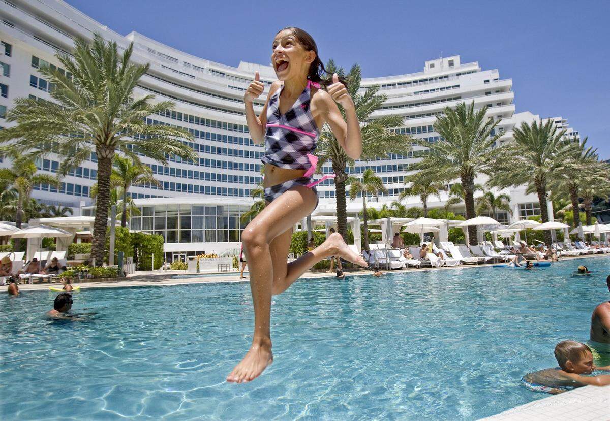 In 2010, 12-year-old Amanda Blanco of West Kendall jumps in the pool, while staying at the Fontainebleau Hotel on Miami Beach with the Flores families who are taking a short vacation across town.