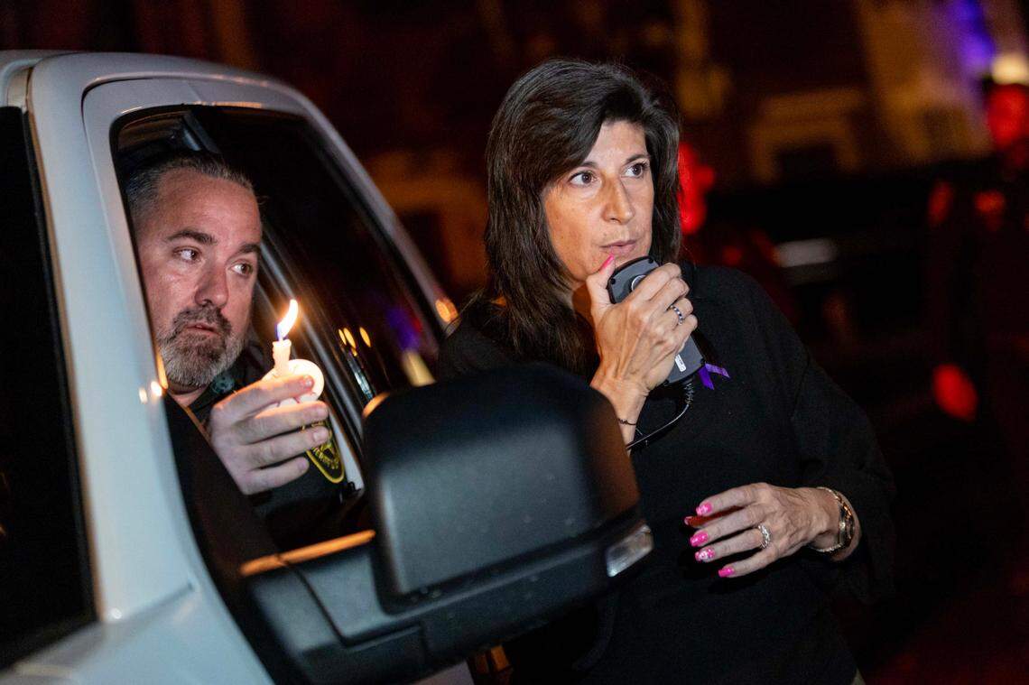 Tamarac Mayor Michelle J. Gomez speaks to mourners during a candlelight vigil Sunday, Feb. 23, 2025, honoring the victims of a triple murder at two homes within the Plum Bay community in Tamarac, Florida.
