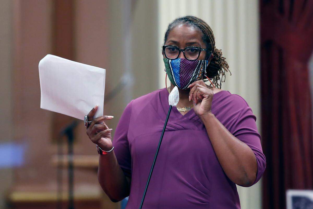 In this June 25, 2020, file photo, State Sen. Holly Mitchell, D-Los Angeles, chair of the Senate Budget and Fiscal Review Committee, discusses one of the more than one dozen budget trailer bills before the Senate at the Capitol in Sacramento, Calif. California lawmakers are setting up a task force to study and make recommendations for reparations to African-Americans, particularly the descendants of slaves, as the nation struggles again with civil rights and unrest following the latest shooting of a Black man by police. The state Senate supported creating the nine-member commission on a bipartisan 33-3 vote Saturday, Aug. 29, 2020. (AP Photo/Rich Pedroncelli, File)