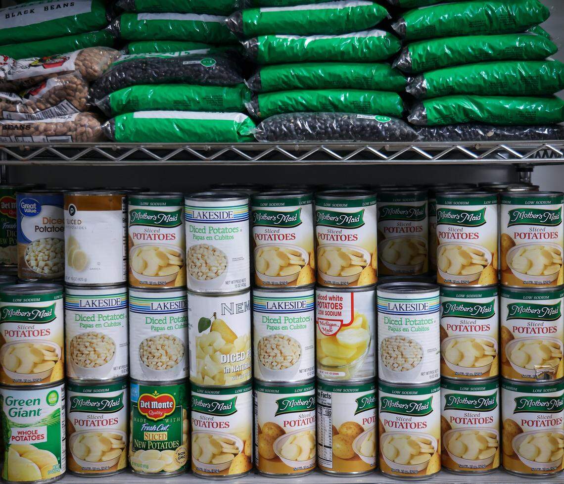 Bags of dried beans and canned goods are stacked up at Feeding South Florida’s pantry in Pembroke Park. Feeding South Florida had to cut its budget significantly to make up for a $17 million loss in federal funds under the Trump administration.