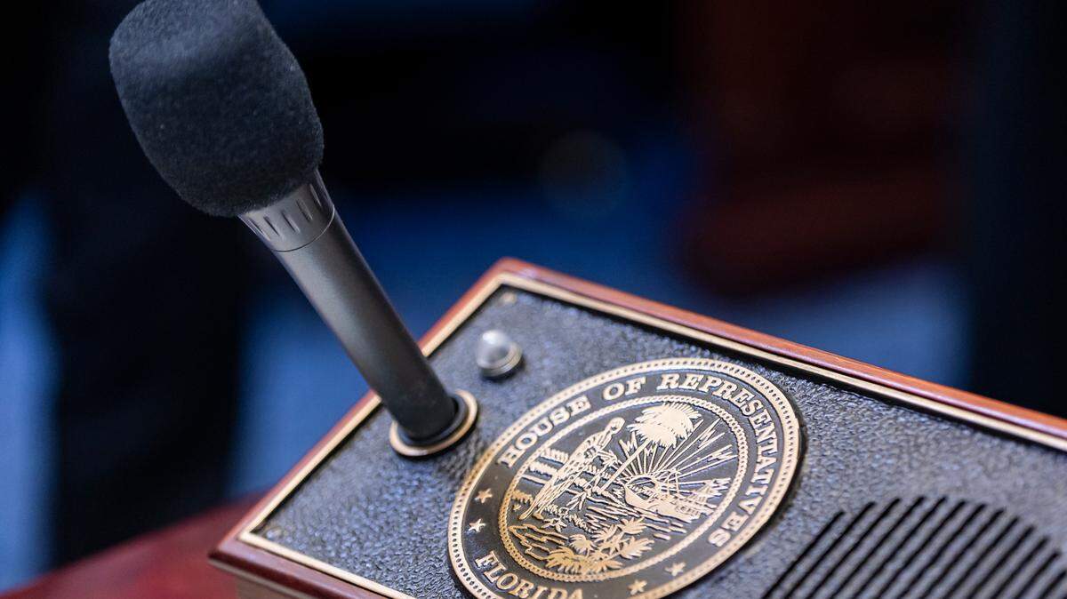A view of a microphone that a state representative can use at their desk inside of the Florida House Chambers during the first day of the legislative session at the Florida State Capitol on Tuesday, March 4, 2025, in Tallahassee, Fla.