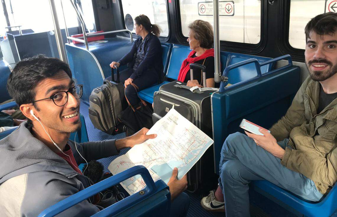 Azhar Chougle, left, and Richard Hankins, right, on the 150 Express bus during Hour 10 of a planned 24-hour marathon of riding Miami-Dade buses to draw attention to fixes needed for the system. The marathon took place on Friday, Dec. 14, 2018.