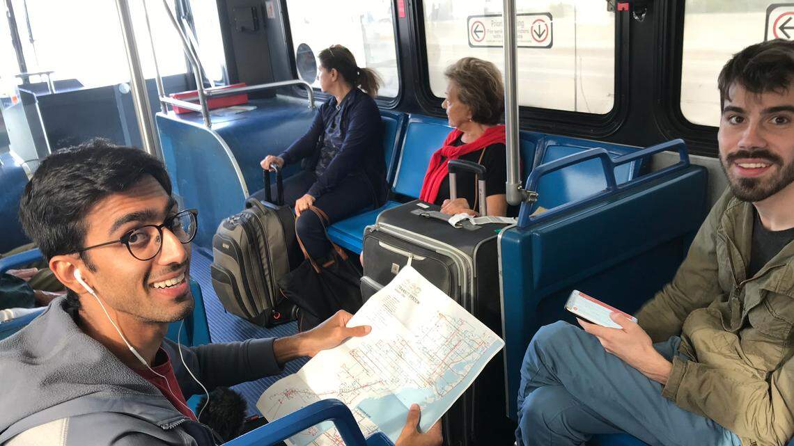 Azhar Chougle, left, and Richard Hankins, right, on the 150 Express bus during Hour 10 of a planned 24-hour marathon of riding Miami-Dade buses to draw attention to fixes needed for the system. The marathon took place on Friday, Dec. 14, 2018.