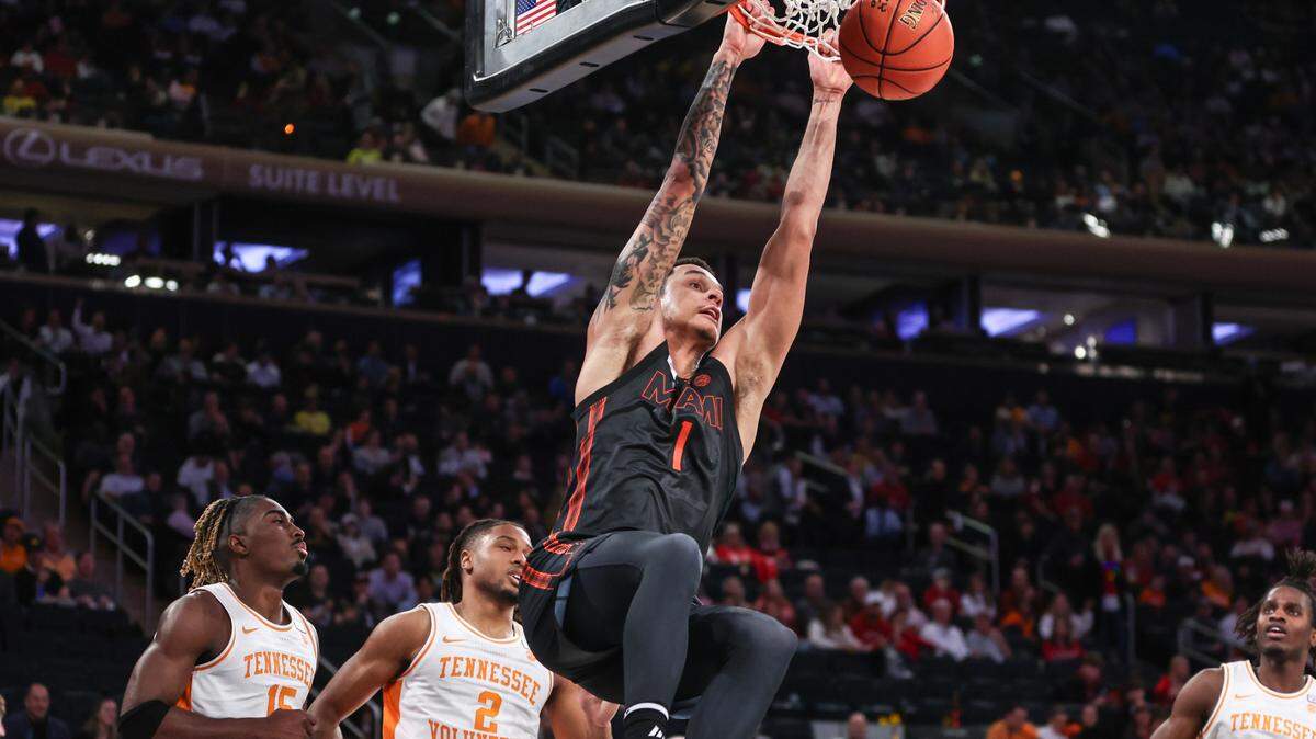 Dec 10, 2024; New York, New York, USA; Miami Hurricanes center Lynn Kidd (1) dunks in the second half against the Tennessee Volunteers at Madison Square Garden. Mandatory Credit: Wendell Cruz-Imagn Images