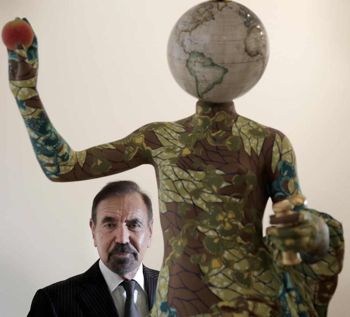 Jorge Perez behind Venus de Arles, 2018, a sculpture by Yinka Shonibare at El Espacio 23.