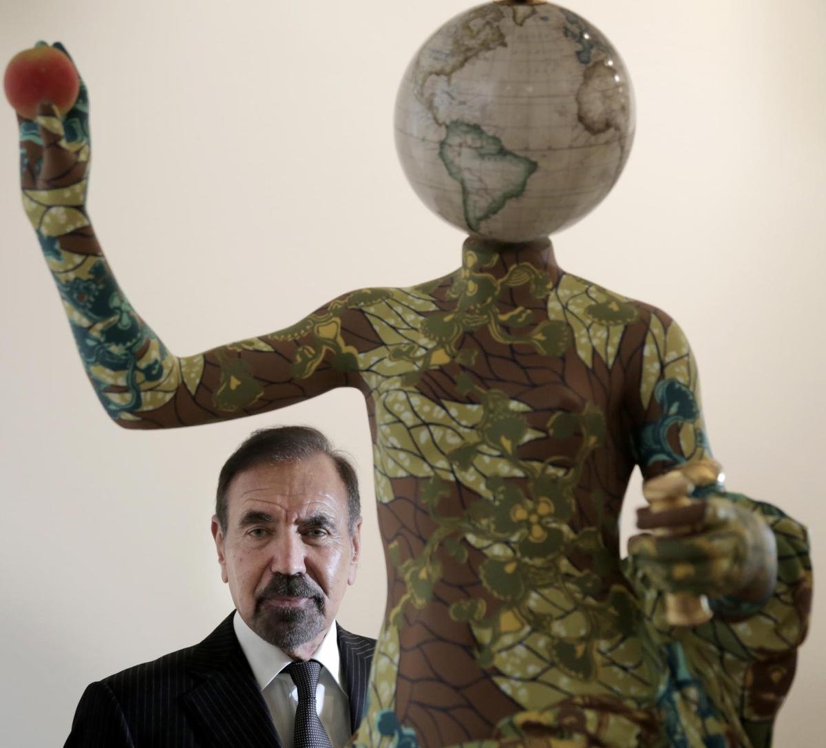 Jorge Perez behind Venus de Arles, 2018, a sculpture by Yinka Shonibare at El Espacio 23.