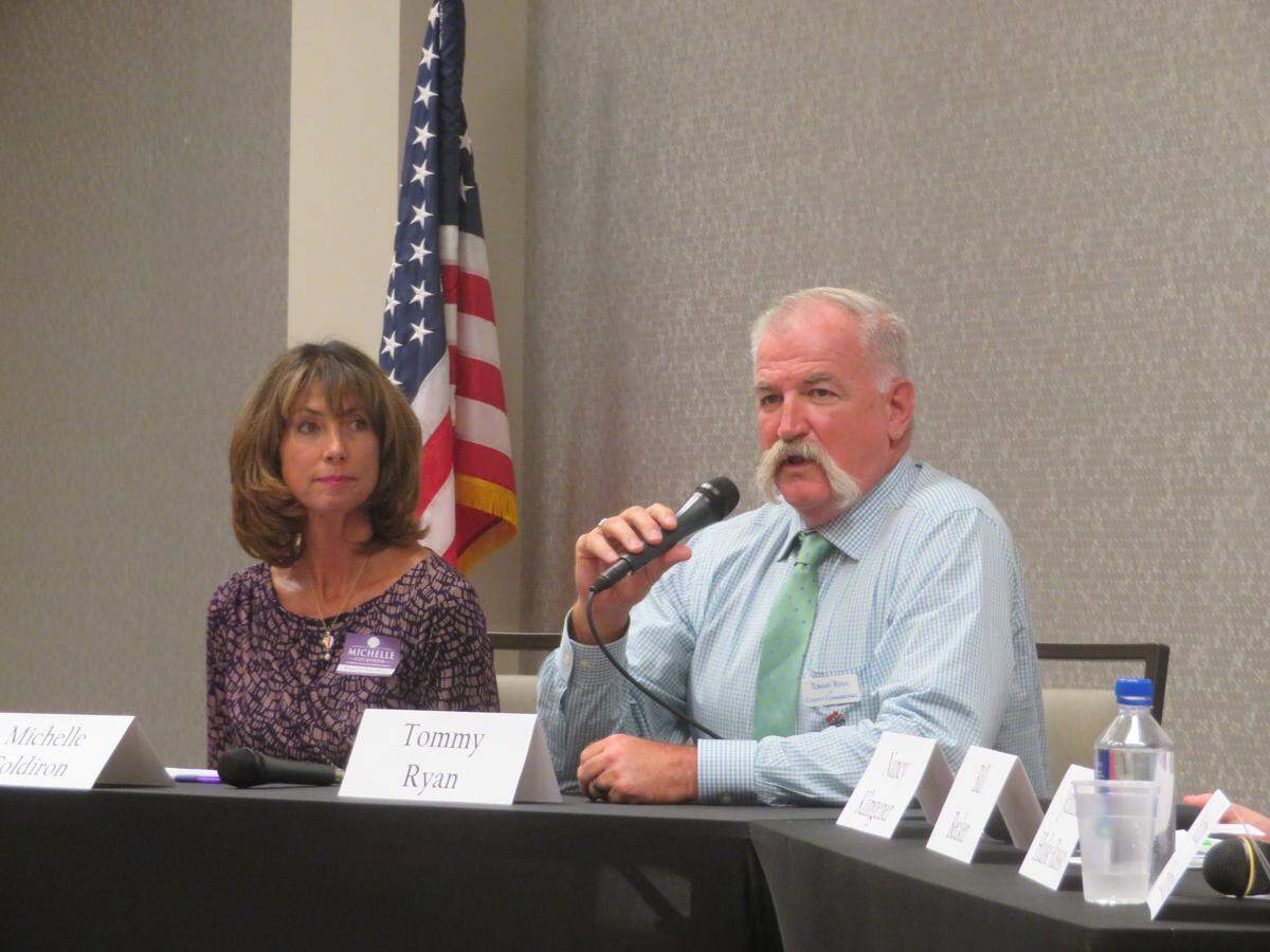 Michelle Coldiron and Tommy Ryan, candidates running for the County Commission District 2 seat, at a recent political forum.