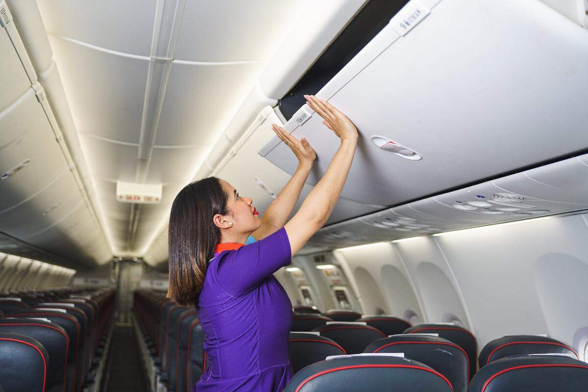 Flight attendant prepares a flight on Arajet.