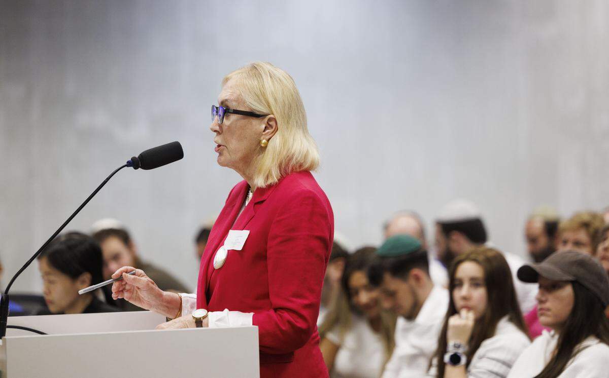 Vanessa Mercier speaks against a mikvah being built on a residential street during a Historic Preservation Board meeting on Tuesday, Dec. 9, 2025, at Hollywood City Hall in Hollywood, Fla. The board must decide whether to approve a mikvah, a Jewish bathhouse, being built on a residential street situated between single family homes.