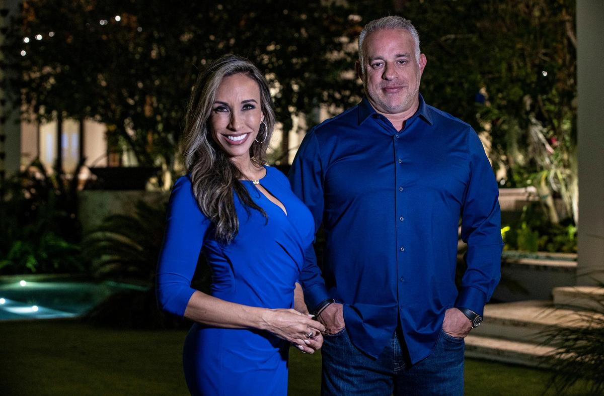 Diana Diaz, former TV anchor and co-chair of the UM Stadium Committee, and MSP Recovery CEO John H. Ruiz posed at Ruiz’s house in Coral Gables on Dec. 8, 2021. He wants to build a stadium for the University of Miami in Coral Gables.
