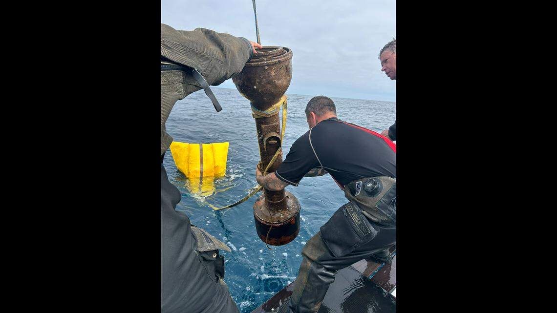 The D/V Tenacious boat crew invested four dives in raising the repeater compass, which is 5-feet tall and weighs 150 pounds, officials said.