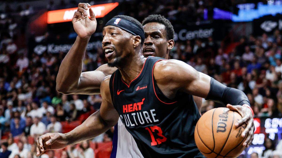 Miami Heat center Bam Adebayo (13) drives the ball as Detroit Pistons center Jalen Duren (0) defends in the second half at Kaseya Center in Miami on March 5, 2024.