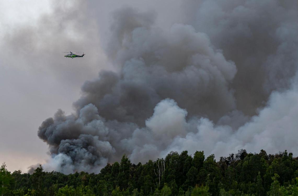 A Miami-Dade Fire Rescue helicopter responds to a brush fire near Southwest 167 Avenue and Southwest 56 Street in Miami, Florida on Monday, May 31, 2021.