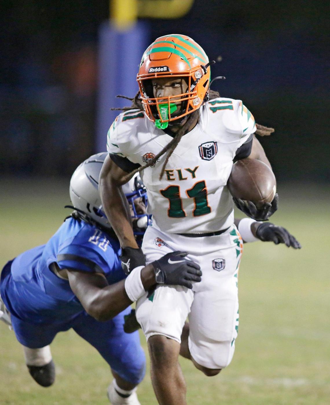 Blanche Ely Tigers running back Cedric Ward (11) carries the ball during football playoff game against Dillard Panthers on Saturday, November 19, 2022 at Dillard HS in Fort Lauderdale. Andrew Uloza / for Miami Herald