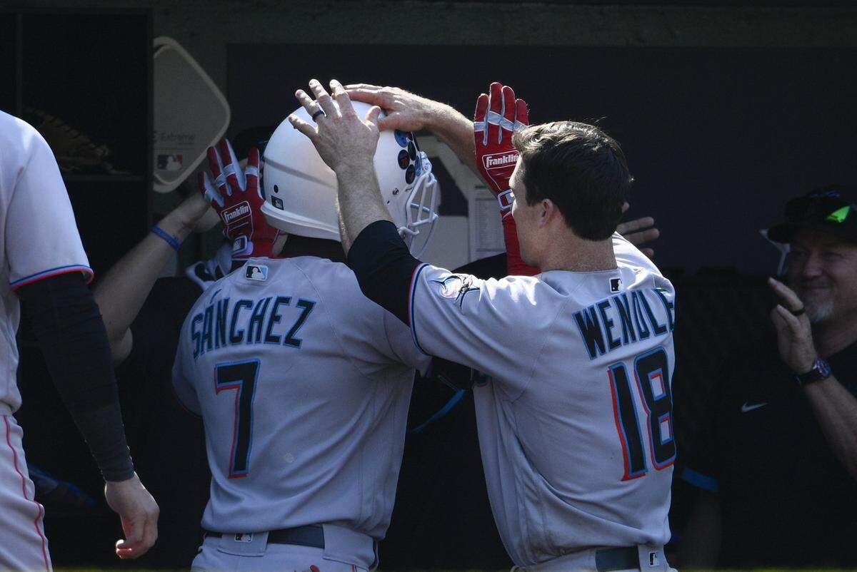 Miami Marlins’ Jesus Sanchez (7) celebrates his two-run home run with Joey Wendle (18) during the ninth inning of a baseball game, Sunday, July 3, 2022, in Washington. (AP Photo/Nick Wass)