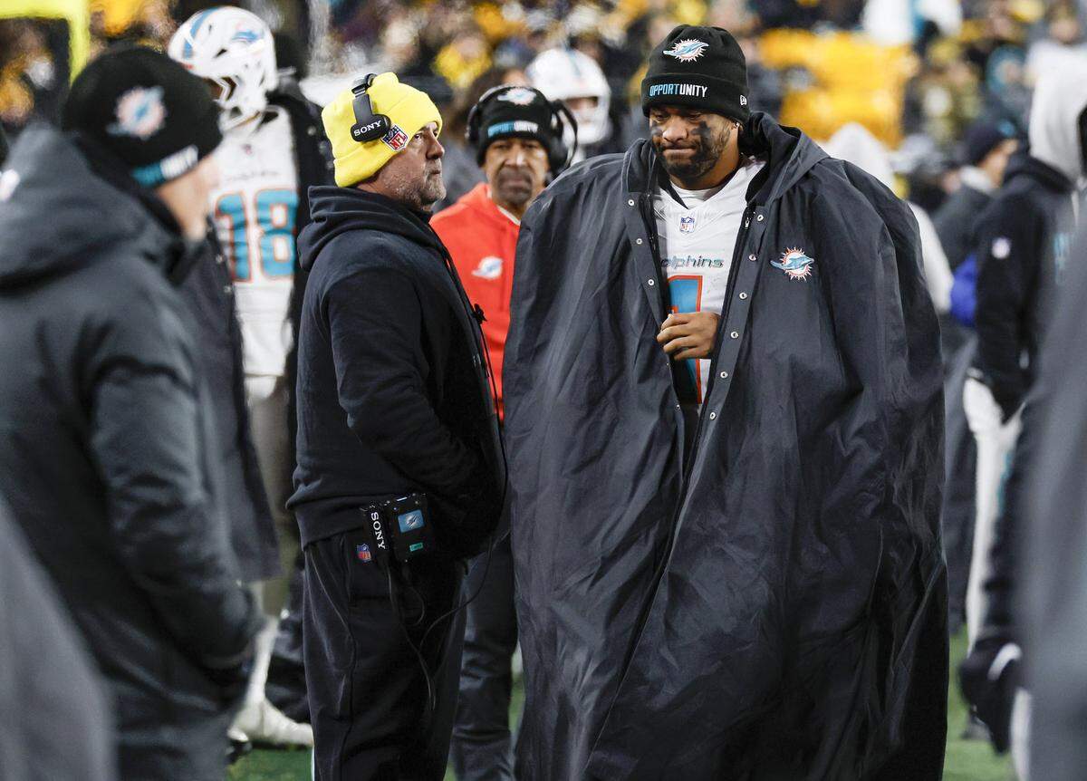 Miami Dolphins quarterback Tua Tagovailoa (1) reacts on the sidelines as the Dolphins trail late in the fourth quarter of their NFL football game against the Pittsburgh Steelers at Acrisure Stadium in Pittsburgh, PA., on Monday, December 15, 2025.