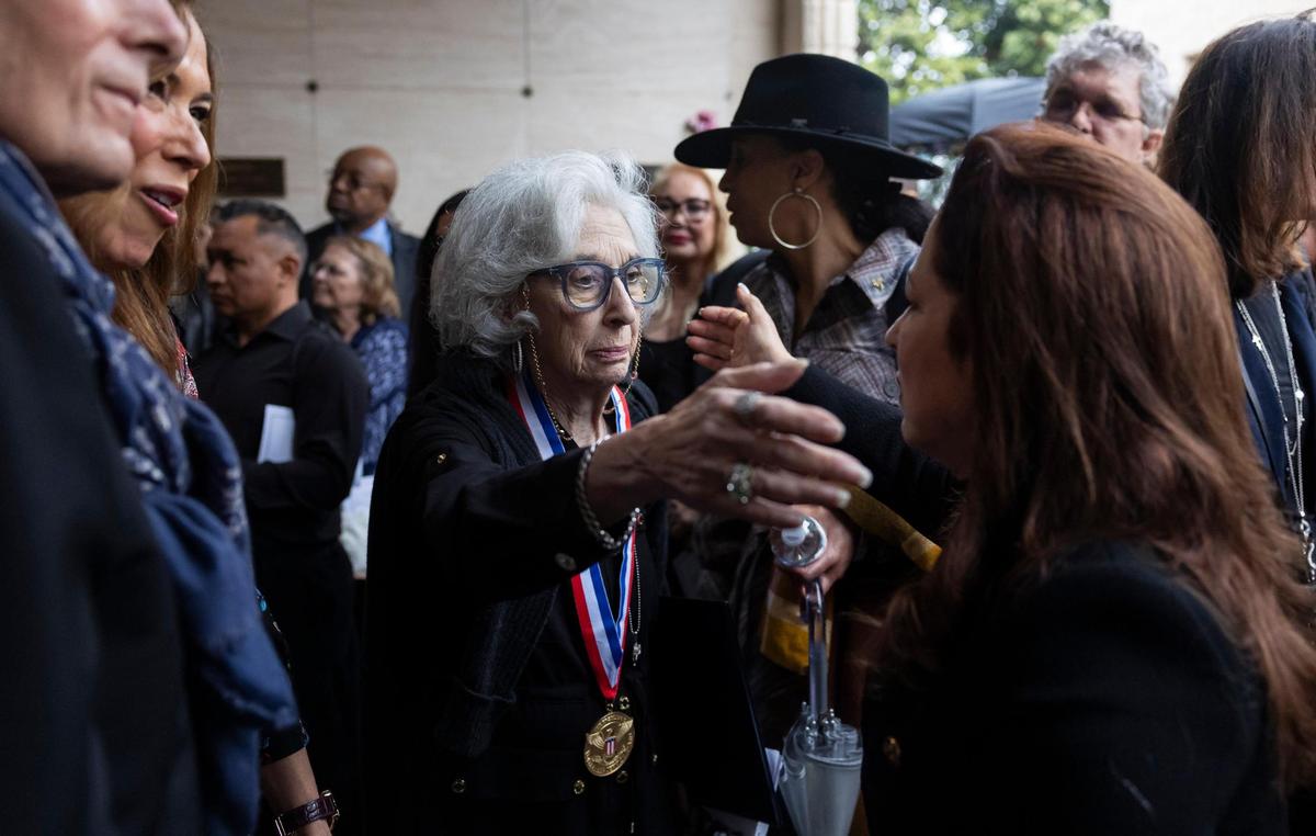 Joyce Moore, left, wife of the late Sam Moore, hugs Gloria Estefan during his funeral service at Lakeside Memorial Park and Funeral Home on Friday, Jan. 17, 2025, in Doral, Fla. Moore, the R&B singer from the famed 1960s duo Sam & Dave, died on Friday, Jan. 10, at the age of 89.