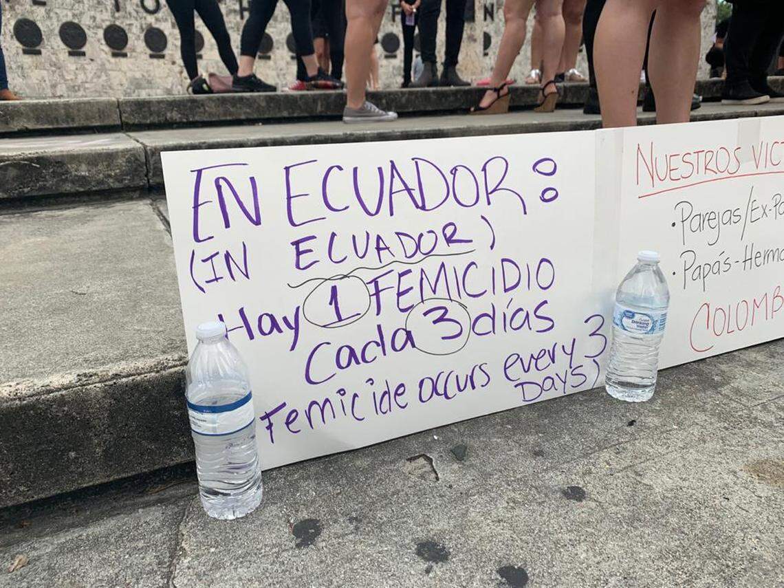A sign showcases data from femicides in Ecuador during the “Un violador en tu camino” or “A Rapist In Your Way” demonstration Sunday, December 8, 2019, at the Torch of Friendship in downtown Miami.