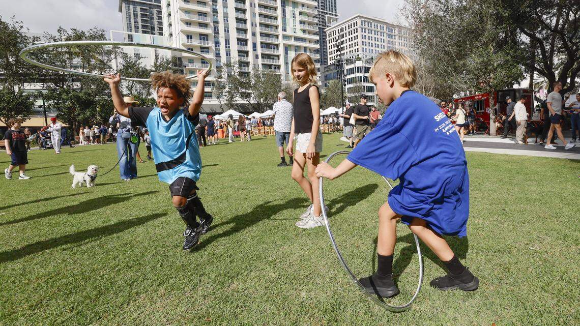 Children play at Huizenga Park as it reopens to the public after a major renovation with a ribbon cutting ceremony in Fort Lauderdale, Florida, on Saturday, January 24, 2026.