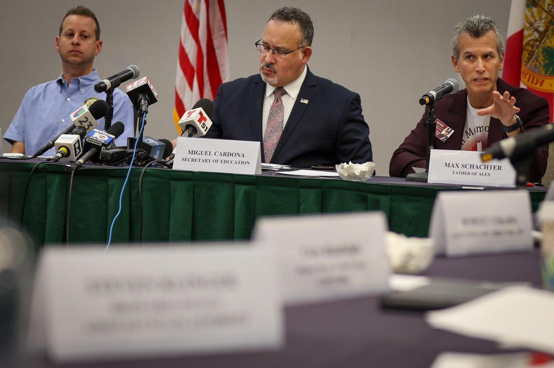 Max Schachter, father of a slain student - Alex, gives his remarks while U.S. Secretary of Education Miguel Cardona, center, takes notes, during a round table with parents of victims of the mass shooting by the invitation of U.S. Congressman Jared Moskowitz, left, regarding school safety and mental health after visiting Marjory Stoneman Douglas High School on Monday, January 22, 2024, in Parkland, Florida.