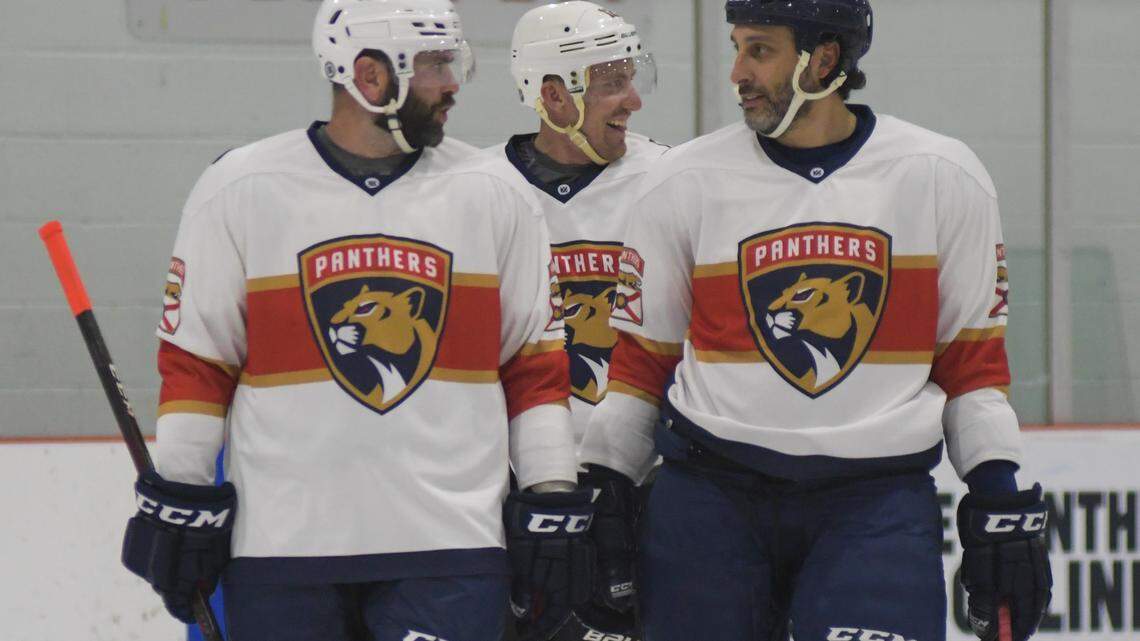 Keith Yandle (left) and Roberto Luongo (right) chat on the ice during the Florida Panthers alumni vs NHL alumni game on Wednesday, Feb. 1, 2023, at the Ice Den in Coral Springs, Florida.