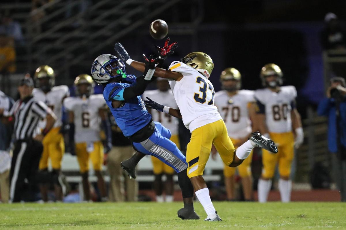 St. Thomas Aquinas defensive back Cameron Williams breaks up a pass intended for Dillard wide receiver Marcus Striggles during the first half on Friday, Oct. 7, 2022 in Fort Lauderdale.