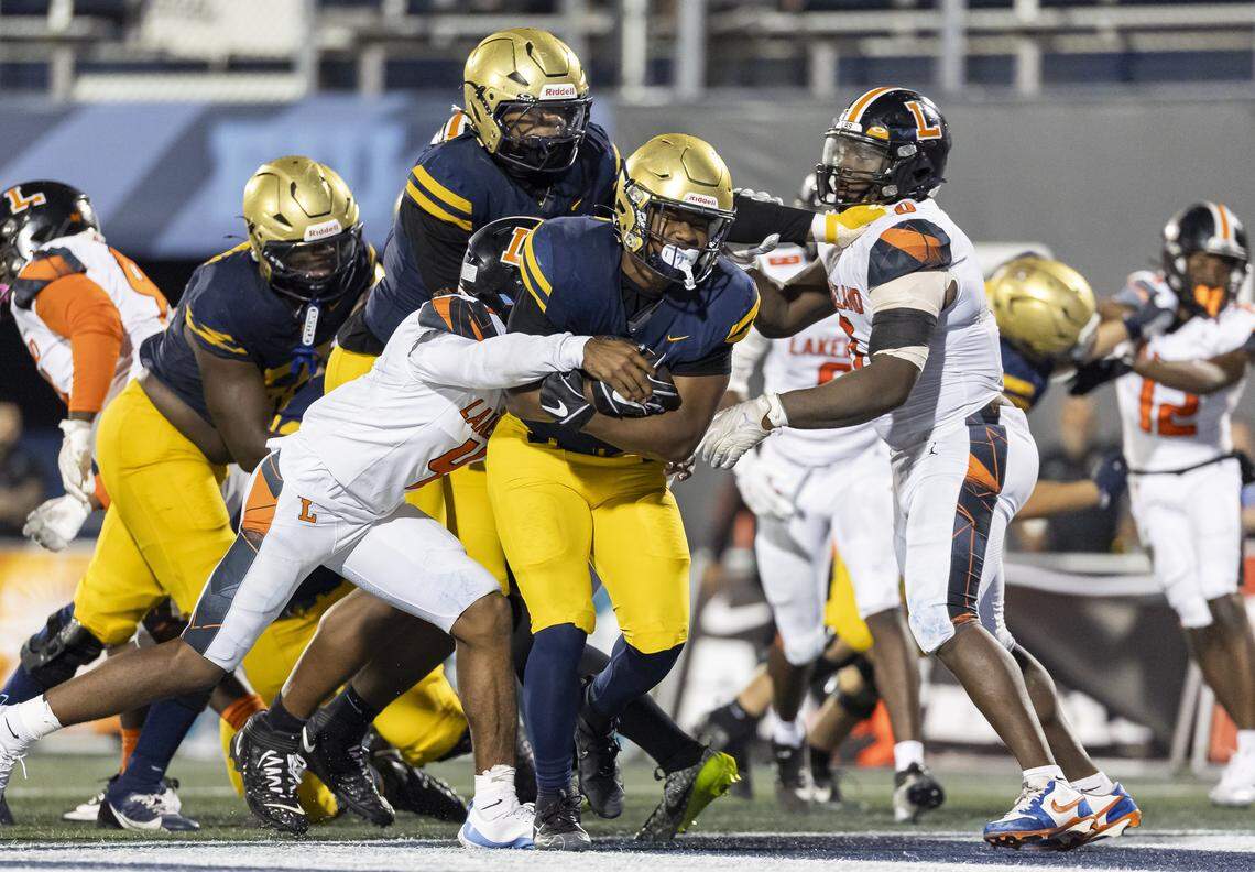 St. Thomas Aquinas Raiders running back Jaden Desir (3) scores a touchdown against the Lakeland Dreadnaughts in the second half of their Class 5A state championship football game at Pitbull Stadium on Thursday, Dec. 11, 2025, in Miami, Fla.