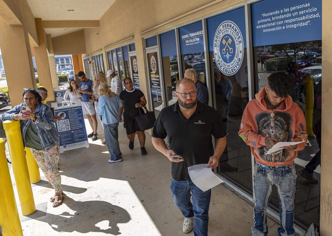 People wait outside a driver license office for their appointments on Tuesday, Feb. 10, 2026, in Hialeah Gardens, Fla. As of Feb. 6, 2026, the Florida Department of Highway Safety and Motor Vehicles requires all driver license knowledge and skills examinations to be conducted exclusively in English.