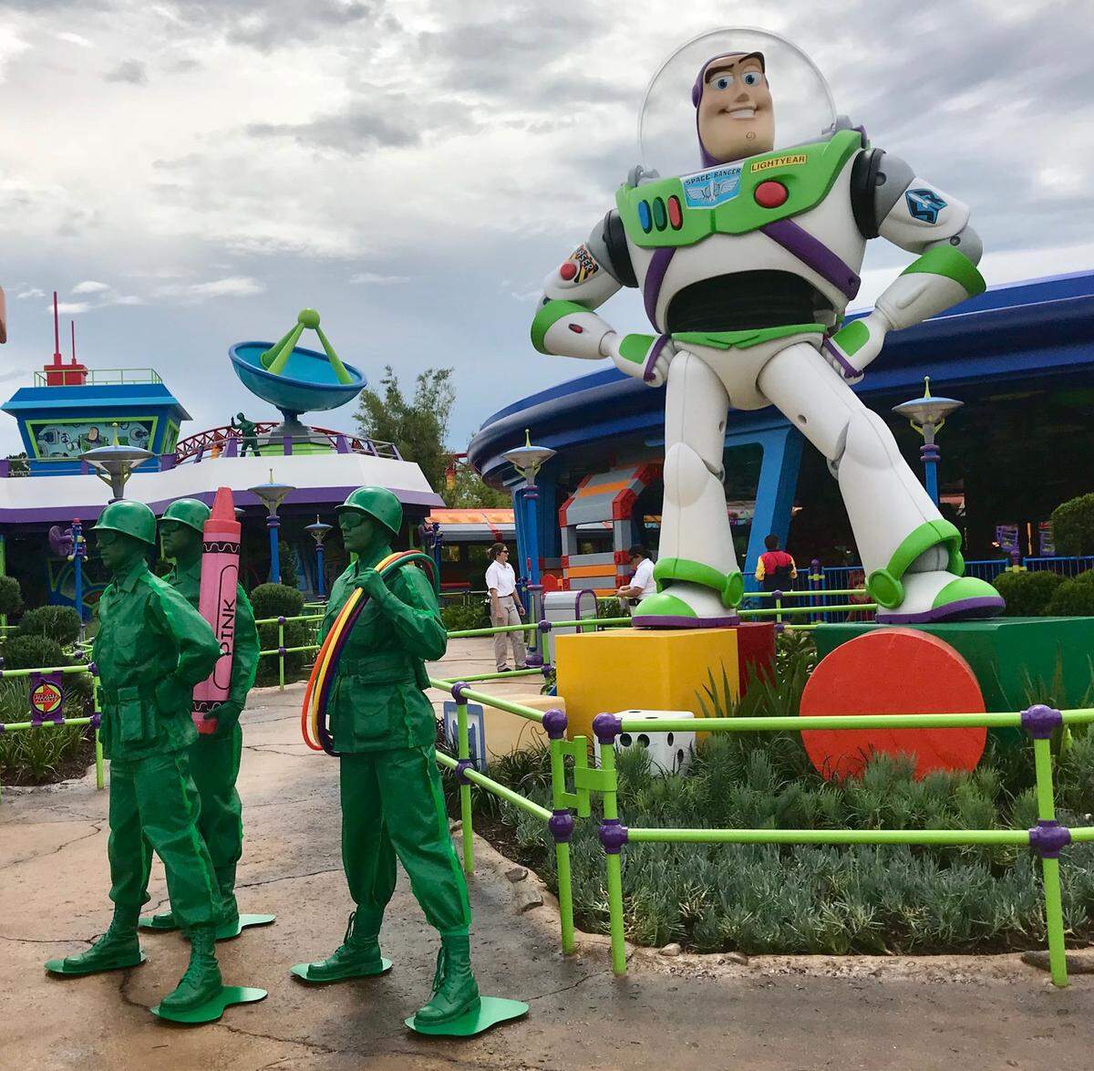 Green Army Men march through Toy Story Land.