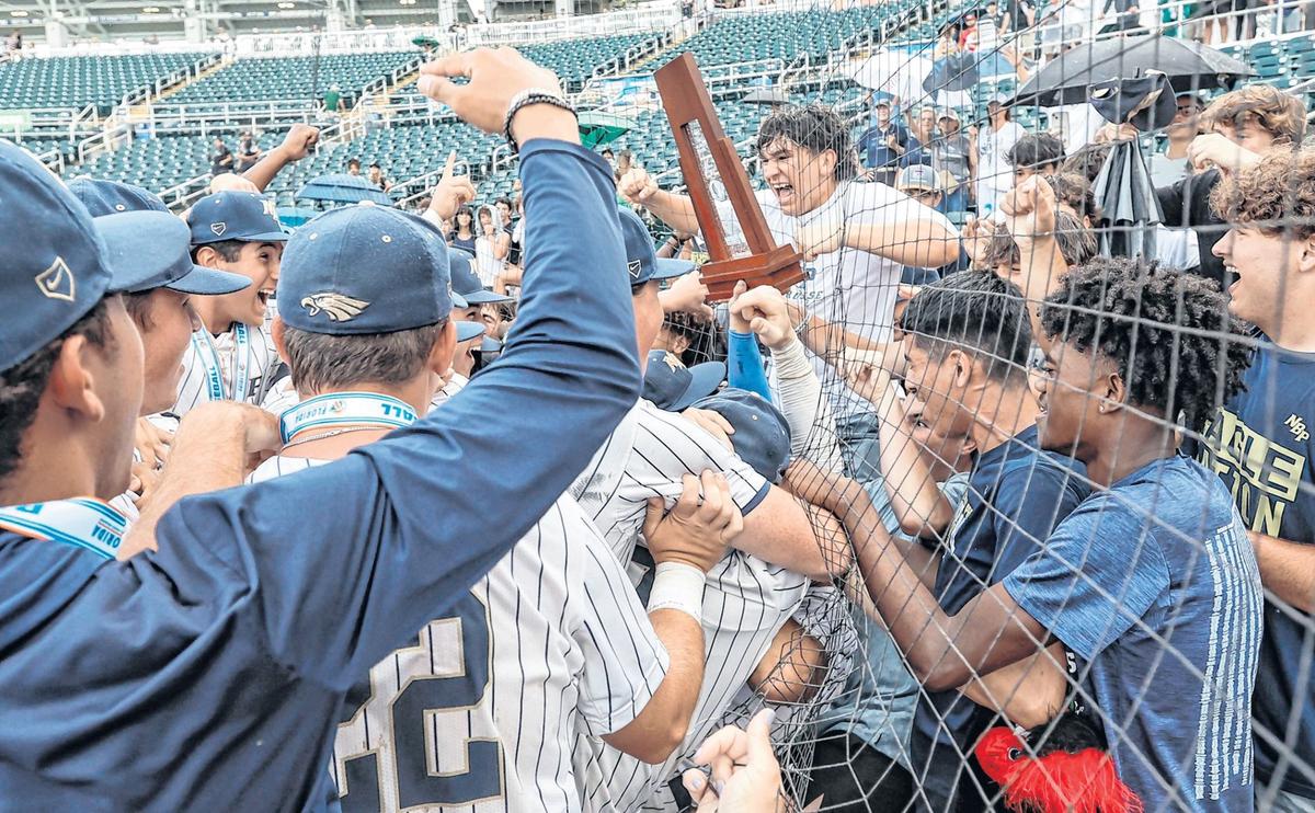 North Broward Prep players celebrate with friends and family in the stands after defeating Westminster Christian in the the FHSAA Baseball Class 3A state final at Hammond Stadium in Fort Myers on Wednesday afternoon.