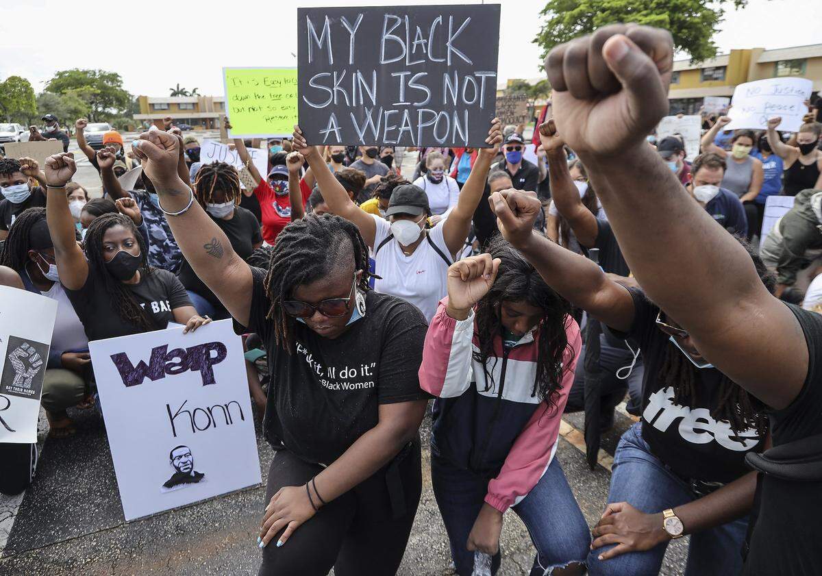 Participants take part in a Black Lives Matter Alliance Broward demonstration in Coral Springs in memory of George Floyd and others who have lost their lives as a result of police brutality, on Tuesday, June 2, 2020.