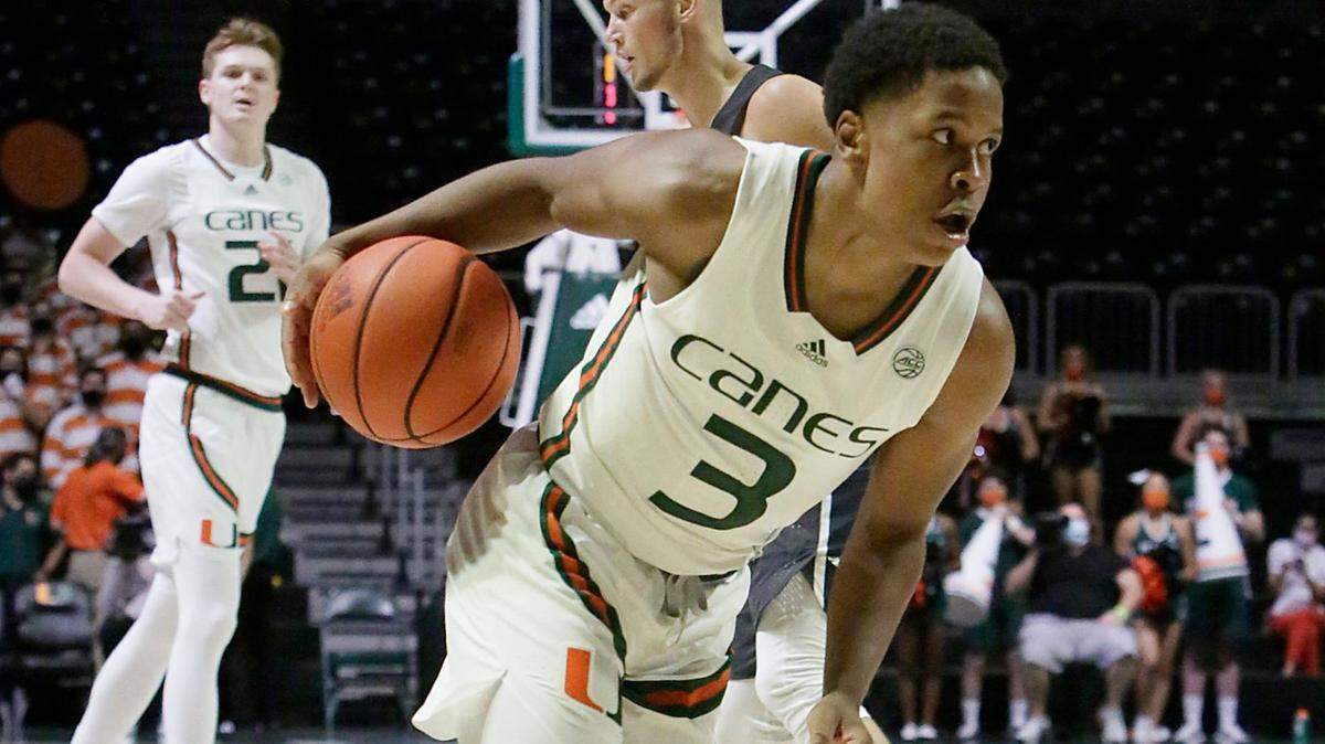 UM Hurricane Charlie Moore (3) dribbles up court against Nova Southeastern Sharks during basketball game on Wednesday, October 20, 2021 at Watsco Center in Coral Gables