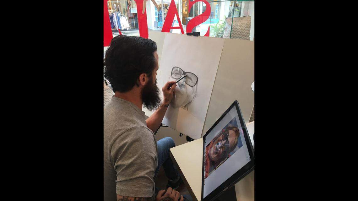 Airan Berry working on a pencil sketch. The photo was shared by his wife, Melanie.