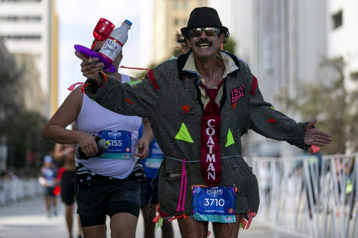 Runners make their way through downtown Miami as they reach the final stretch of the 18th annual Life Time Miami Marathon and Half Marathon on Sunday, February 9, 2020. There were more than 20,000 combined runners registered for the marathon and half marathon.