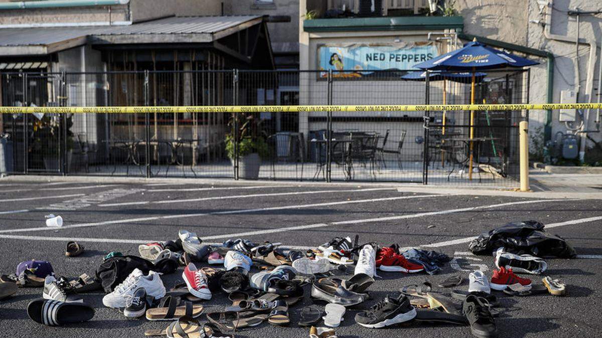Shoes of victims of the August mass shooting in Dayton, Ohio, are piled at the scene.