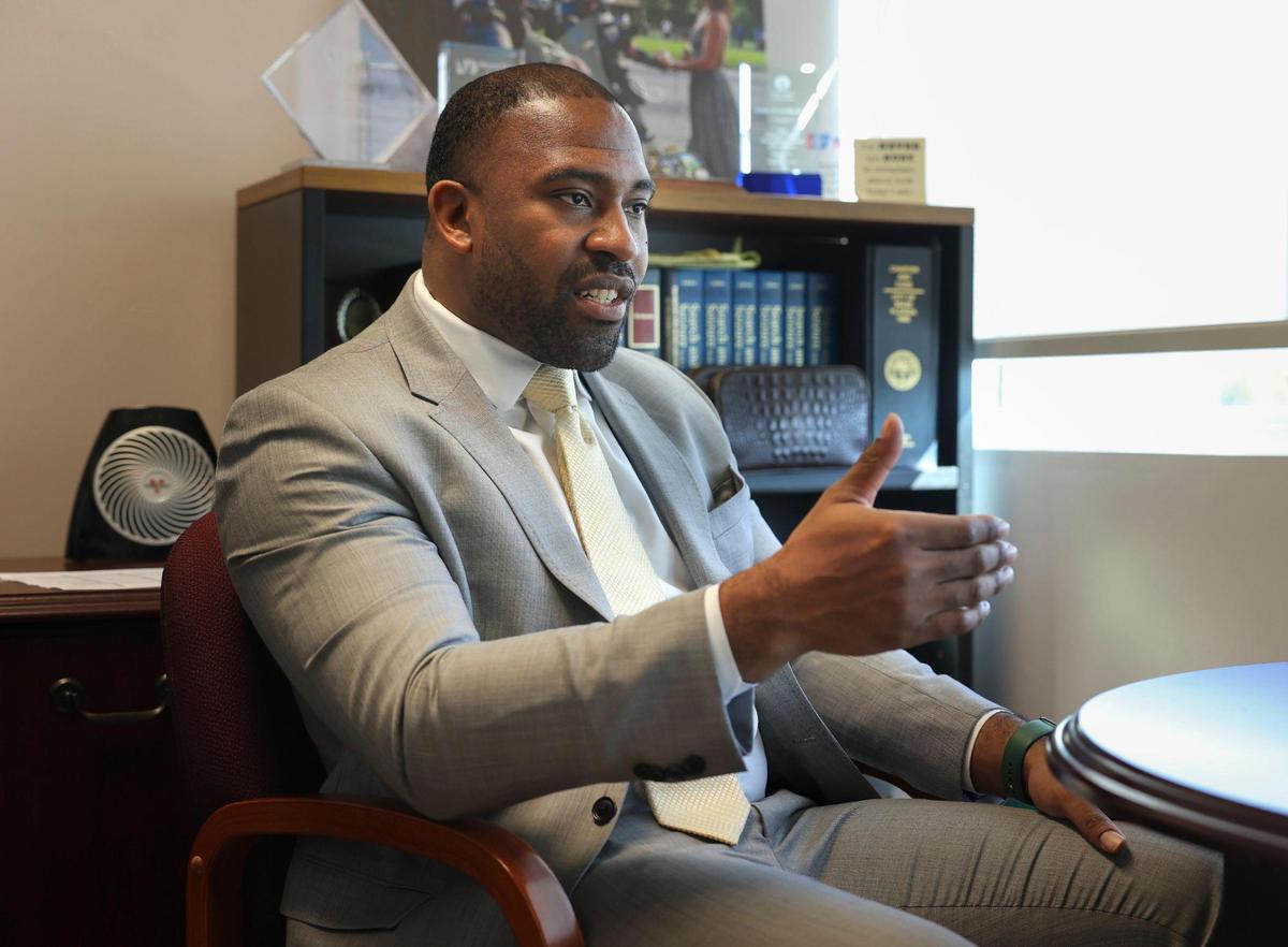Rodney Jacobs, Assistant Director of the Miami Civilian Investigative Panel, poses in his office on Tuesday, Oct. 25, 2022, in Miami. The Civilian Investigative Panel works with the police force to find better ways to approach policing.