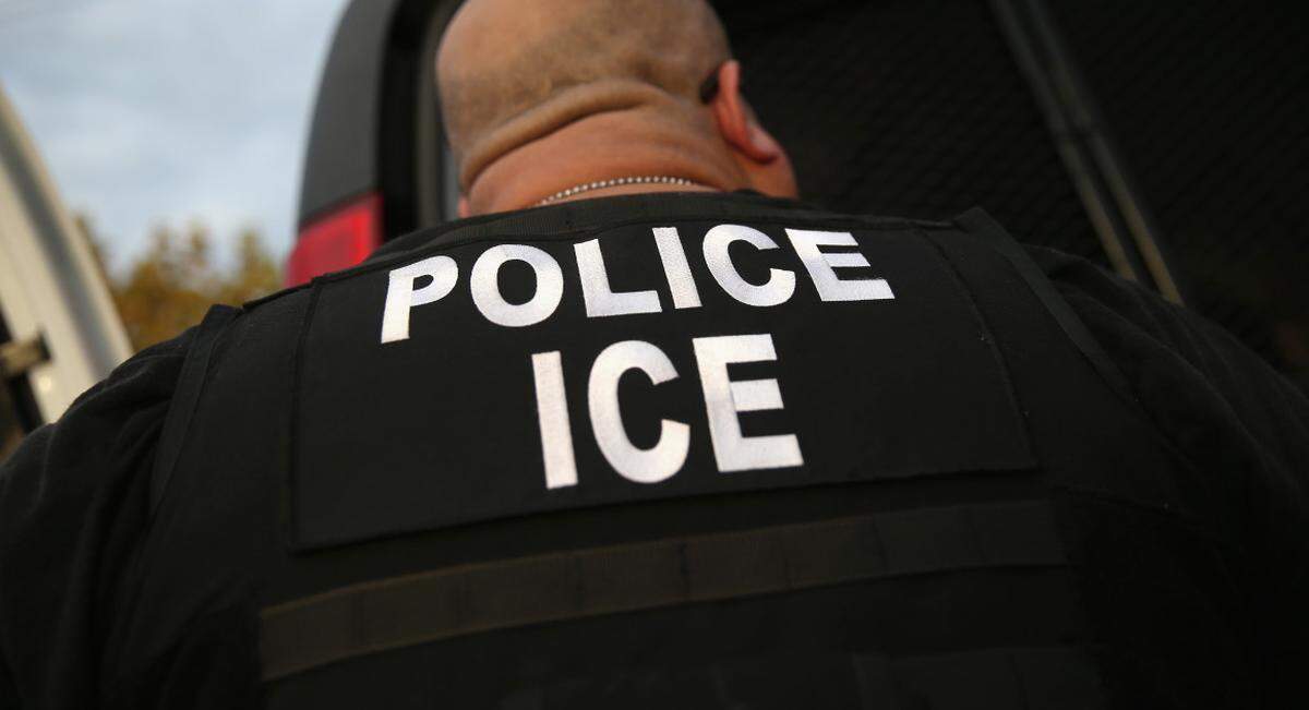 An ICE agent.