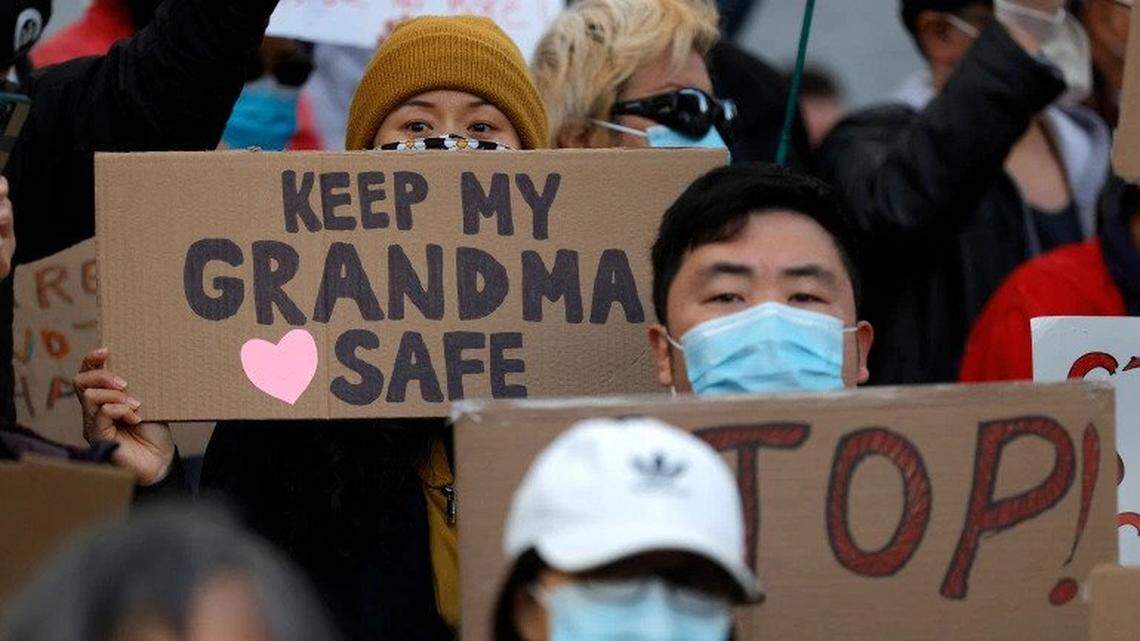 In March, people hold signs during a rally outside the San Francisco Hall of Justice in solidarity with Asian-hate crime victims.