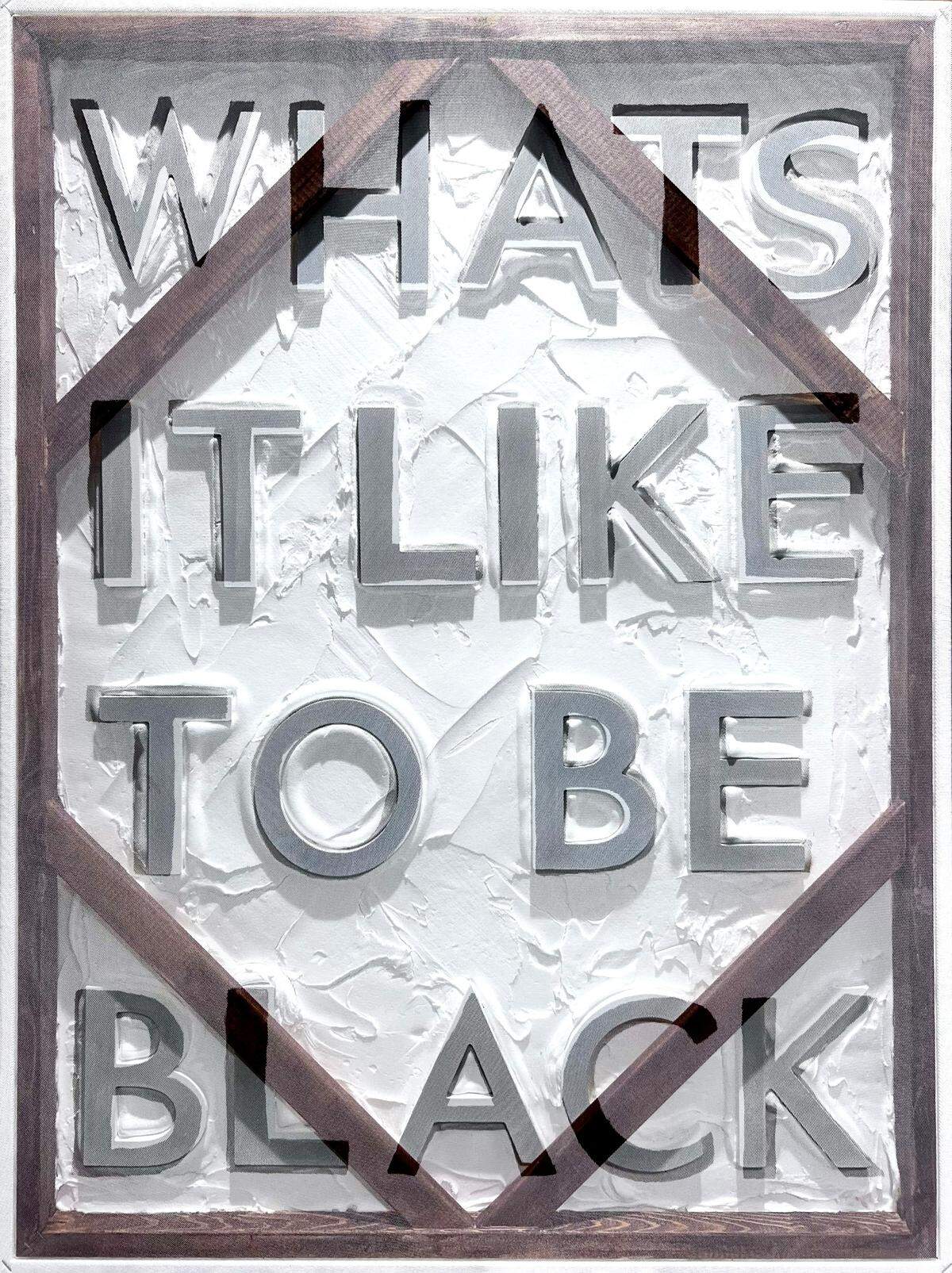 A piece from the ‘BLACK Card’ exhibit asks about the meaning of being Black. The exhibit is on display at the Historic Ward Rooming House in Overtown through August.