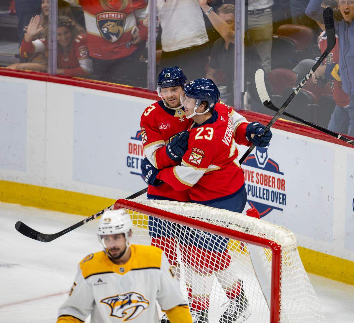 Florida Panthers center Carter Verhaeghe (23) celebrates with teammate Sam Reinhart (13) after scoring a goal during the second period of an NHL game against the Nashville Predators at the Amerant Bank Arena on Thursday, Nov. 7, 2024, in Sunrise, Fla.