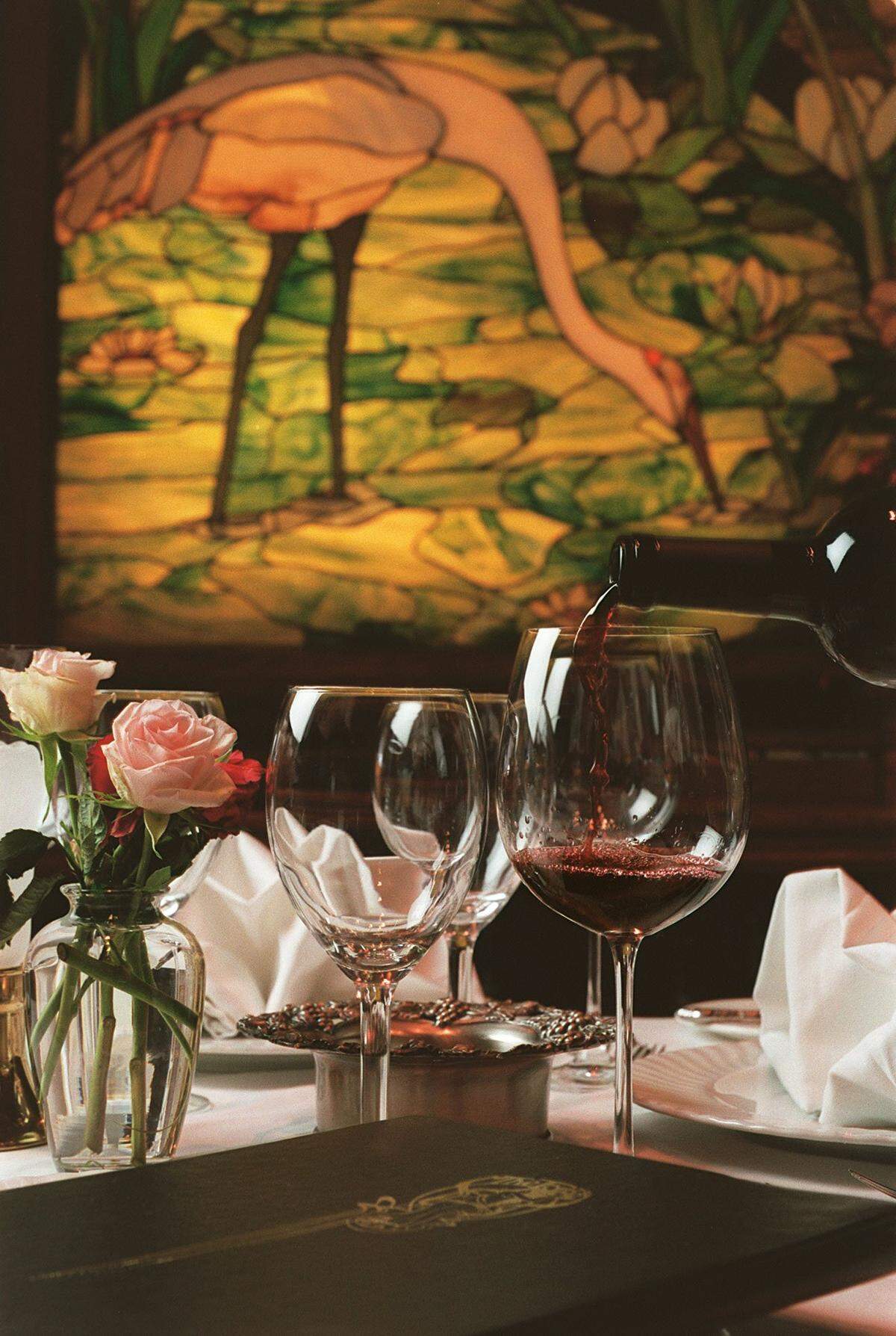 Gino Santangelo, sommelier at The Forge Restaurant in MIami Beach, pours a St. Clement Merlot, of California in the glass.
