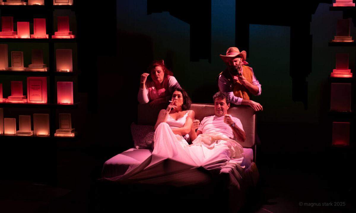 Delia (Dalia Aleman) in bed with Peter (Stephen Schnetzer) as their figment-of-Delia’s-imagination counterparts (Margot Moreland and Ben Sandomir) hover over the headboard in “Left on Tenth,” now at GableStage in Coral Gables through Dec. 21.