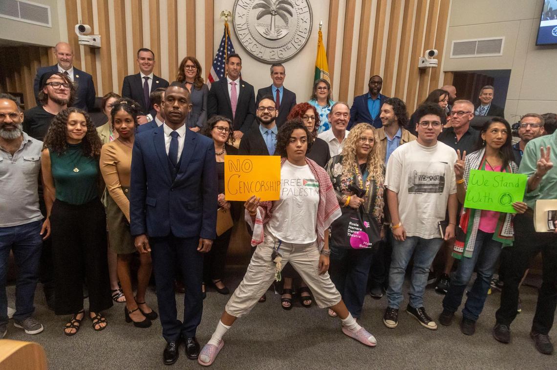 Miami Beach elected officials pose with people who attended the City Commission meeting on Wednesday, March 19, 2025, after Mayor Steven Meiner withdrew a resolution to terminate O Cinema’s lease.